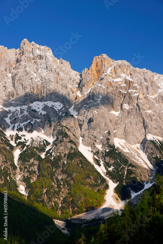 Amazing spring landscape of Skrlatica Peak (2740m) in the Julian Alps, Triglav National Park, Slovenia photo