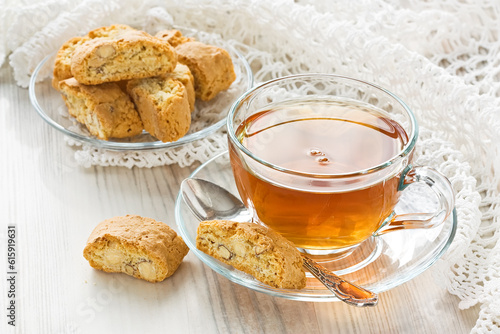 Transparent cup herbal tea with homemade cantuccini cookies