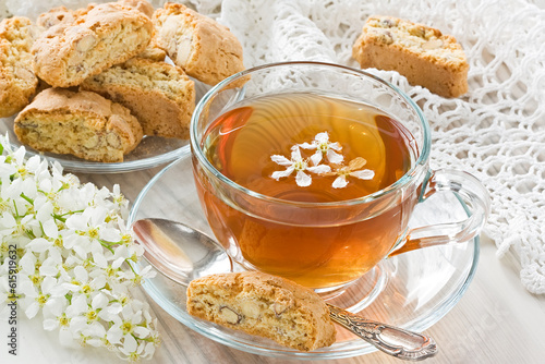 Transparent cup herbal tea and homemade cantuccini cookies