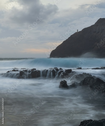 Hawaii long exposure by the rocks and lighthouse