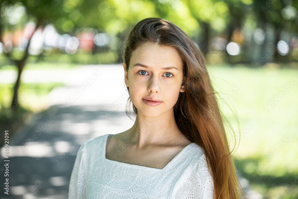 Portrait of a young tenager girl, summer park outdoors Portrait of a young tenager girl, summer park outdoors
