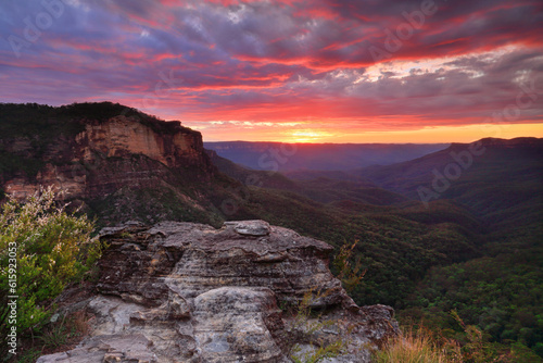Views over the Jamison Balley as the first light of the still unrisen sun lights up the sky. Location Blue Mountains, Australia