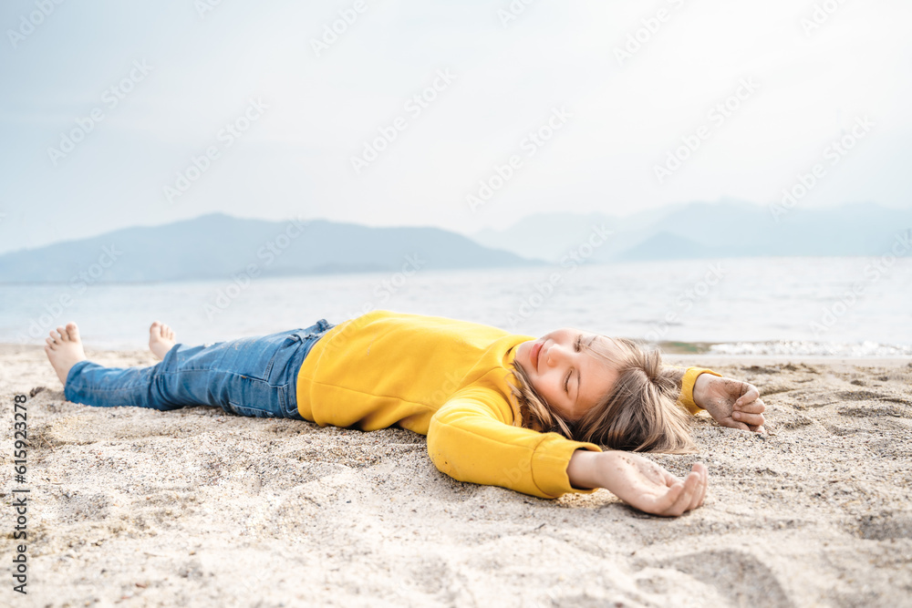 Lonely beautiful sad girl teenager lying sleeping on sand sea beach. Dreams,anxiety,worries about future,school friends,parents. Teen bullying, psychological problems in adolescent puberty period Lonely beautiful sad girl teenager lying sleeping on sand sea beach. Dreams,anxiety,worries about future,school friends,parents. Teen bullying, psychological problems in adolescent puberty period