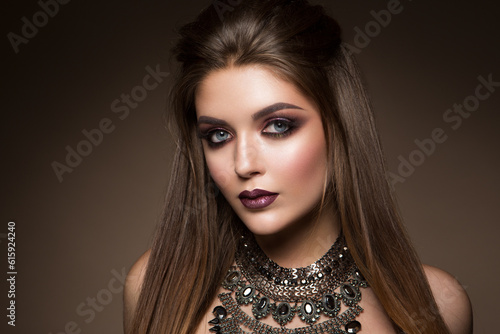 Beauty portrait of model with natural make-up. Fashion shiny highlighter on skin  sexy gloss lips make-up