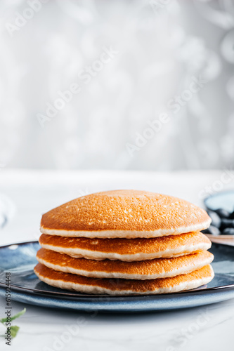 Wallpaper Mural Fresh American Pancakes on blue plate and white background Torontodigital.ca