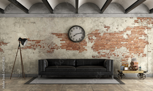 Black sofa in a grunge room with old brick wall - 3d rendering