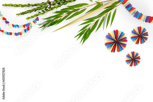 Jewish holiday of Sukkot. Traditional symbols  (citron), lulav (palm branch), hadas (myrtle), arava (willow), colorful decorations photo
