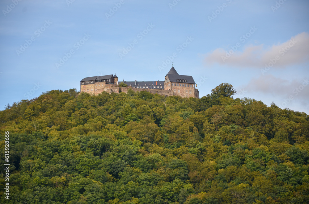 View of the fortress Waldeck on a mountain at the Edersee with cloudy sky in the background