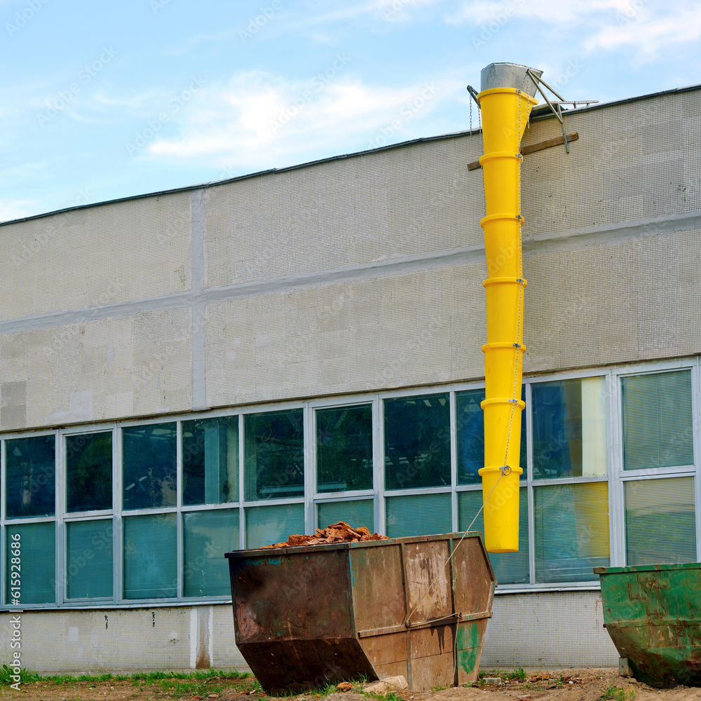 Debris chute and waste container, disposal of construction waste during