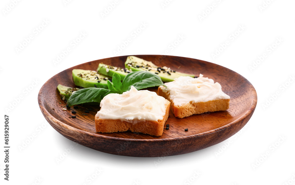 Plate of tasty croutons with cream cheese and avocado on white background Plate of tasty croutons with cream cheese and avocado on white background