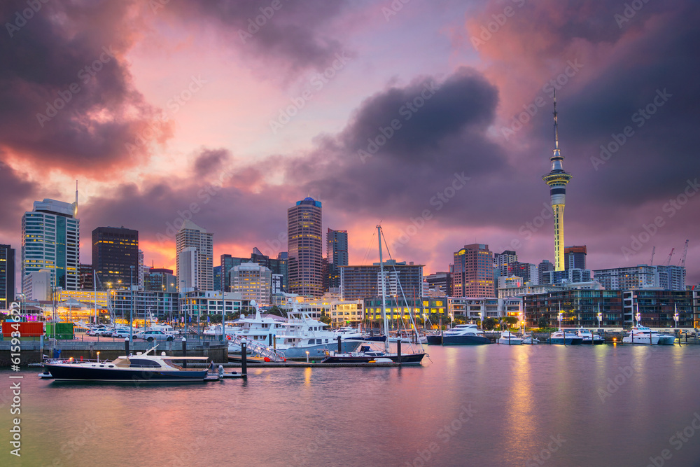 Cityscape image of Auckland skyline, New Zealand during sunrise.