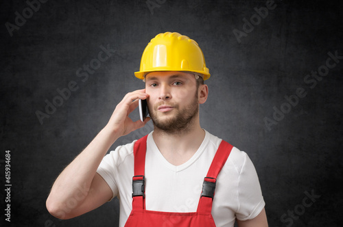 Portrait of a construction worker talking on phone