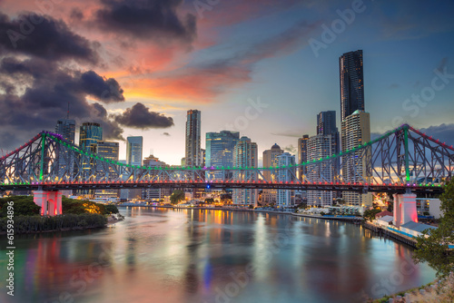 Cityscape image of Brisbane skyline, Australia with Story Bridge during dramatic sunset. © Designpics