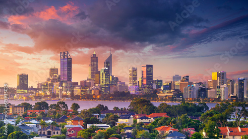 Panoramic aerial cityscape image of Perth skyline, Australia during dramatic sunset.