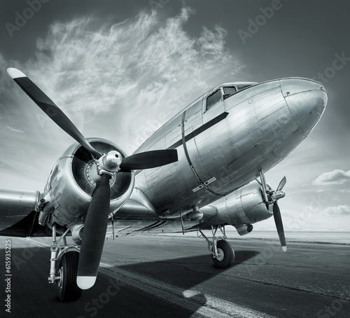 historical aircraft on a runway is waiting for take off