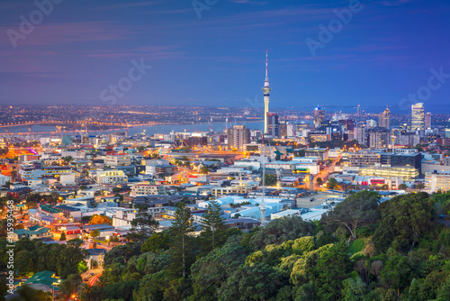 Cityscape image of Auckland skyline  New Zealand taken from Mt. Eden at dusk.