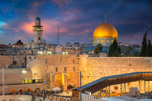 Cityscape image of Jerusalem, Israel with Dome of the Rock and Western Wall at sunset.