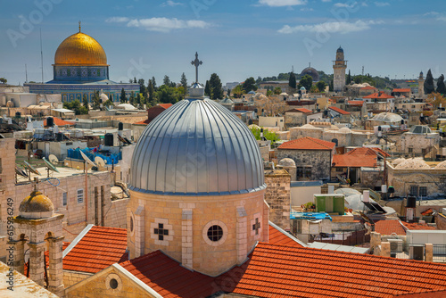 Cityscape image of old town Jerusalem, Israel with the Church of St. Mary of agony and the Dome of the Rock photo