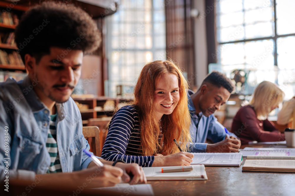 Joyful student in school library. Joyful student in school library.