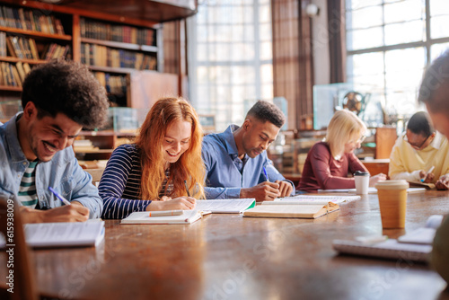 Students doing homework in library.