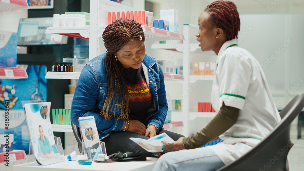 Health specialist giving medical advice and pills to girl, recommending medicaments from pharmacy store. Young female pharmacist explaining about drugs treatment to customer. Handheld shot. Health specialist giving medical advice and pills to girl, recommending medicaments from pharmacy store. Young female pharmacist explaining about drugs treatment to customer. Handheld shot.