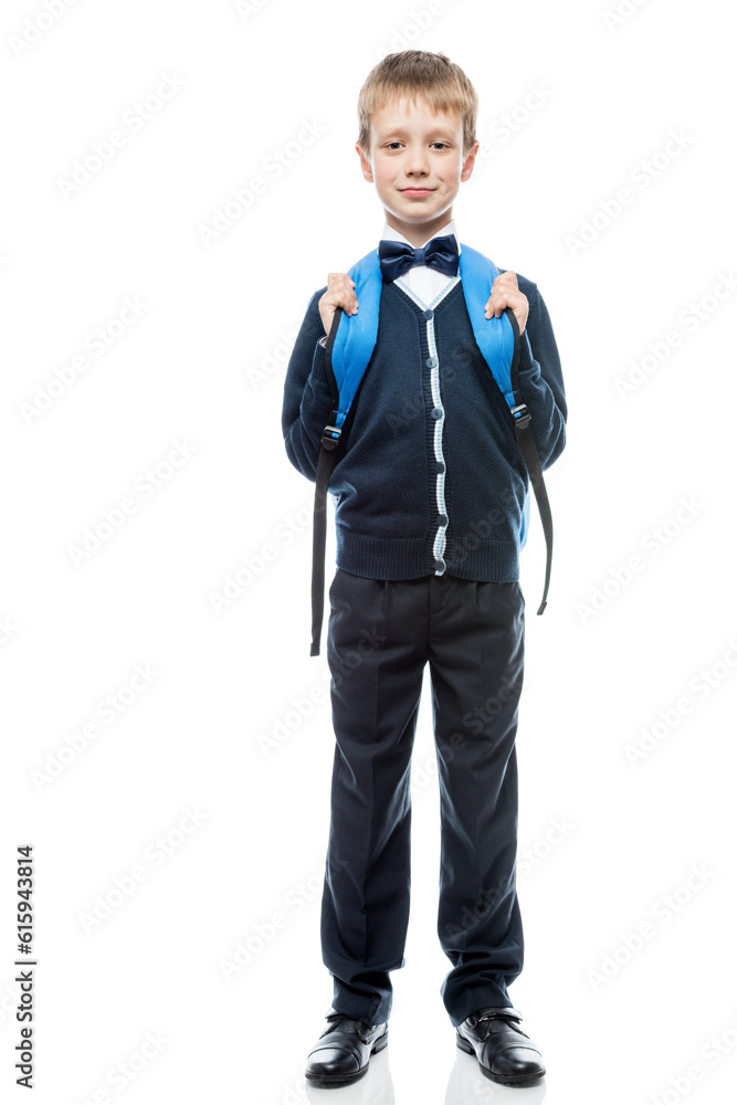 vertical portrait of a schoolboy with a backpack in the form in full length isolated vertical portrait of a schoolboy with a backpack in the form in full length isolated
