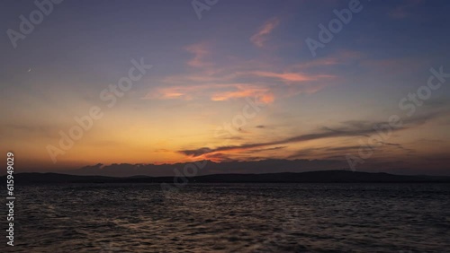 Sunset in the mountains and sea timelapse