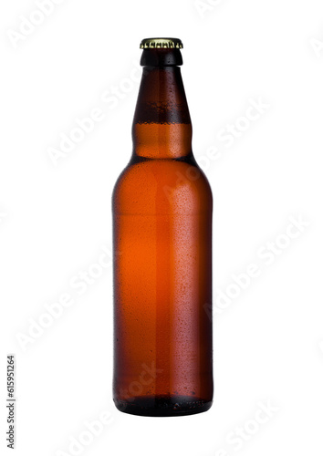 Brown glass lager beer bottle with black cap isolated on white background with dew