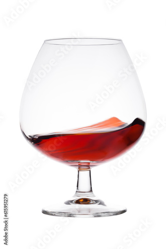 Elegant glass with brandy cognac alcohol drink isolated on white background