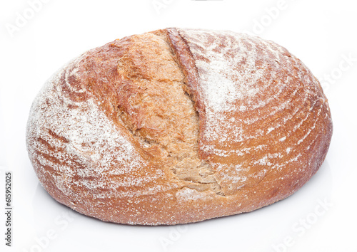 Freshly baked loaf of bread with flour on white background