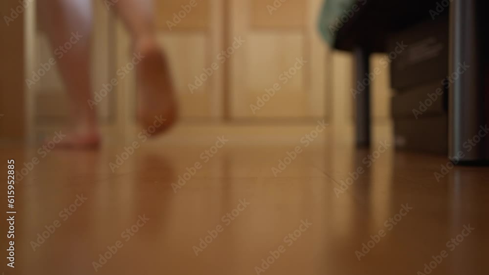Anonymous person starting the day by getting out of bed. Video of bare feet getting out of bed and stepping on the floor to start their daily routine. Anonymous person starting the day by getting out of bed. Video of bare feet getting out of bed and stepping on the floor to start their daily routine.