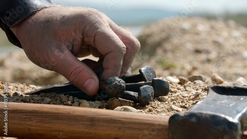 Soldier taking nails for the crucifixion of Jesus. Detail