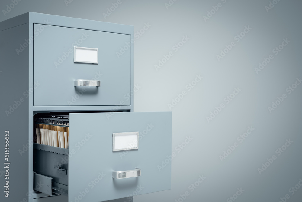 Filing cabinet with open drawer and folders inside, storage and administration concept Filing cabinet with open drawer and folders inside, storage and administration concept