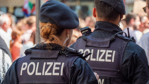 German police officers on duty on the street. ("POLICE" in German)