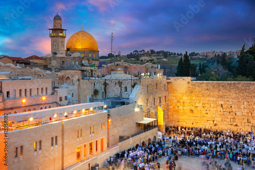 Cityscape image of Jerusalem, Israel with Dome of the Rock and Western Wall at sunset.