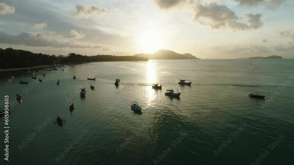 Flight over of long tail fishing boats at tropical sunrise or sunset sky over sea,Beautiful light nature landscape Flight over of long tail fishing boats at tropical sunrise or sunset sky over sea,Beautiful light nature landscape