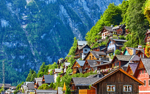 Hallstatt, Austria. Vintage wooden houses on slopes knolls on banks of lake Hallstattersee among austrian Alps mountains.