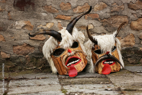 Traditional Kukeri costume masks on a traditional Bulgarian Kukeri holidays festival Breznik, Bulgaria photo