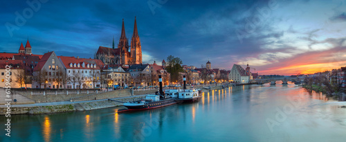 Panoramic cityscape image of Regensburg, Germany during spring sunset.