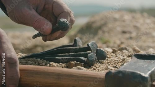 Soldier taking nails for the crucifixion of Jesus. Detailed
