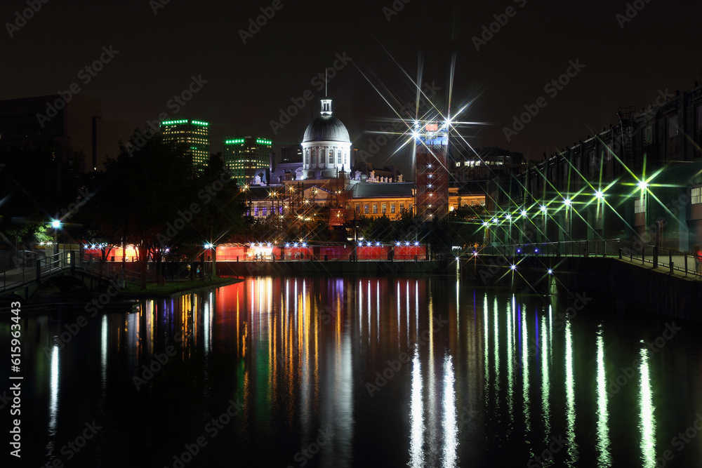 View of Marche Bonsecours in Old port in Montreal. Old Port of Montreal by night. Night city colorful lights reflection in water. View of Marche Bonsecours in Old port in Montreal. Old Port of Montreal by night. Night city colorful lights reflection in water.