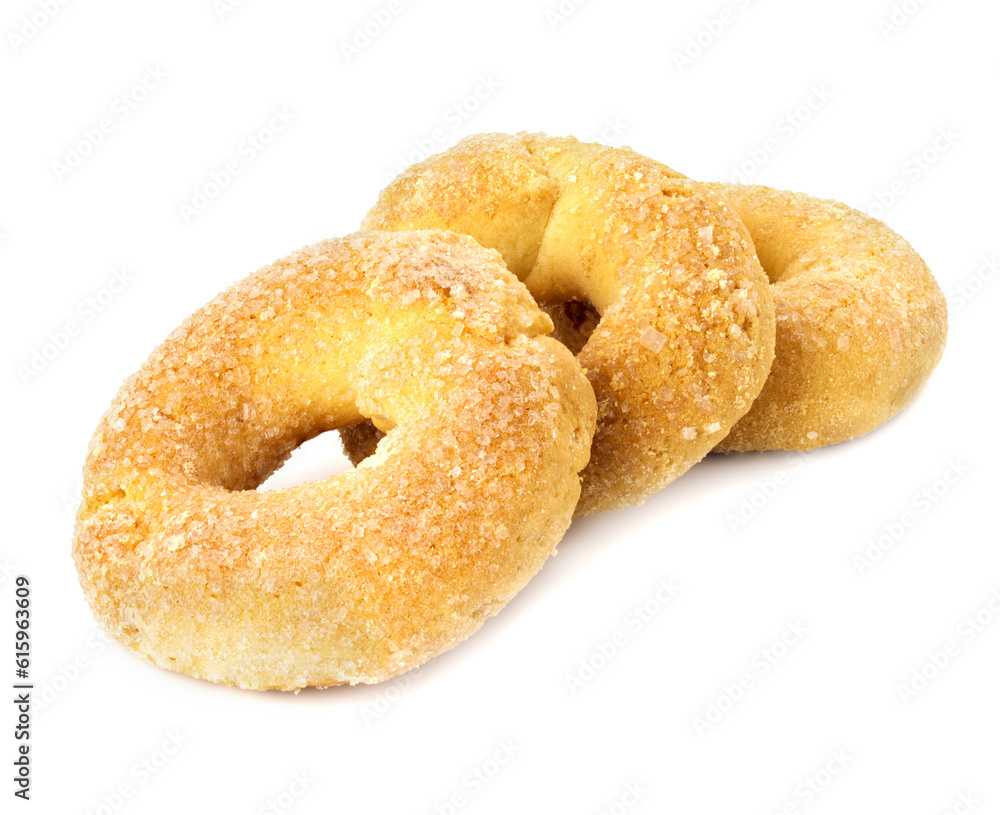 three fried biscuits with sugar on white background