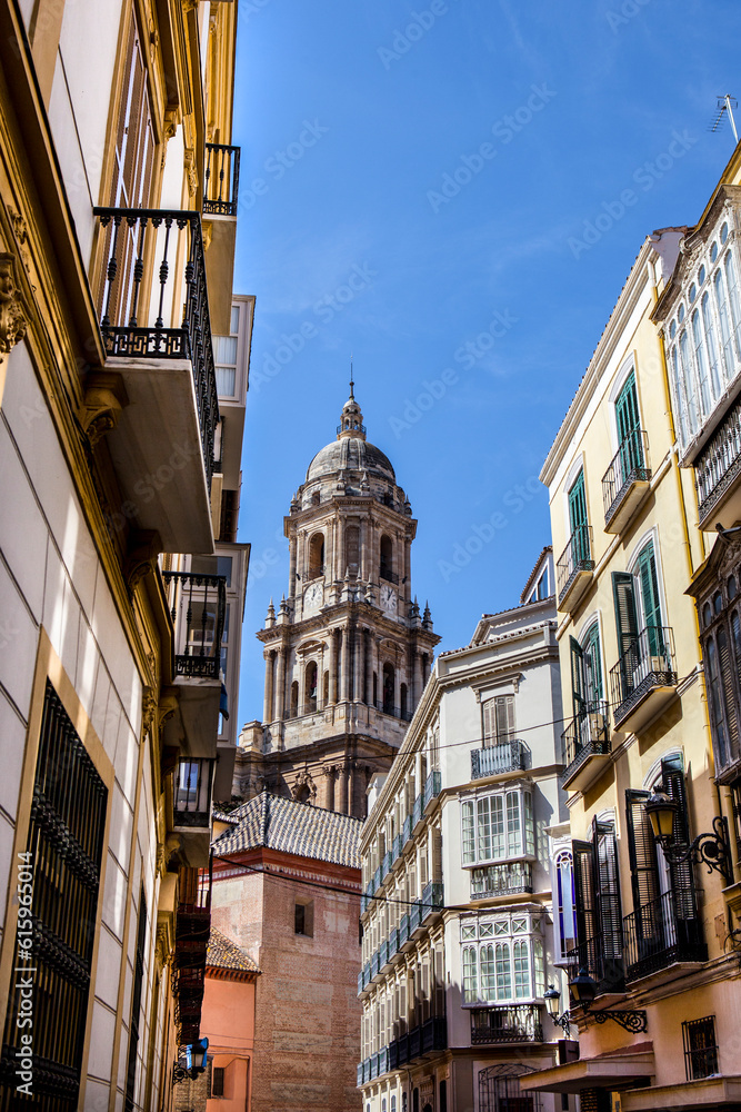 Malaga Cathedral tower from old town streets, Spain