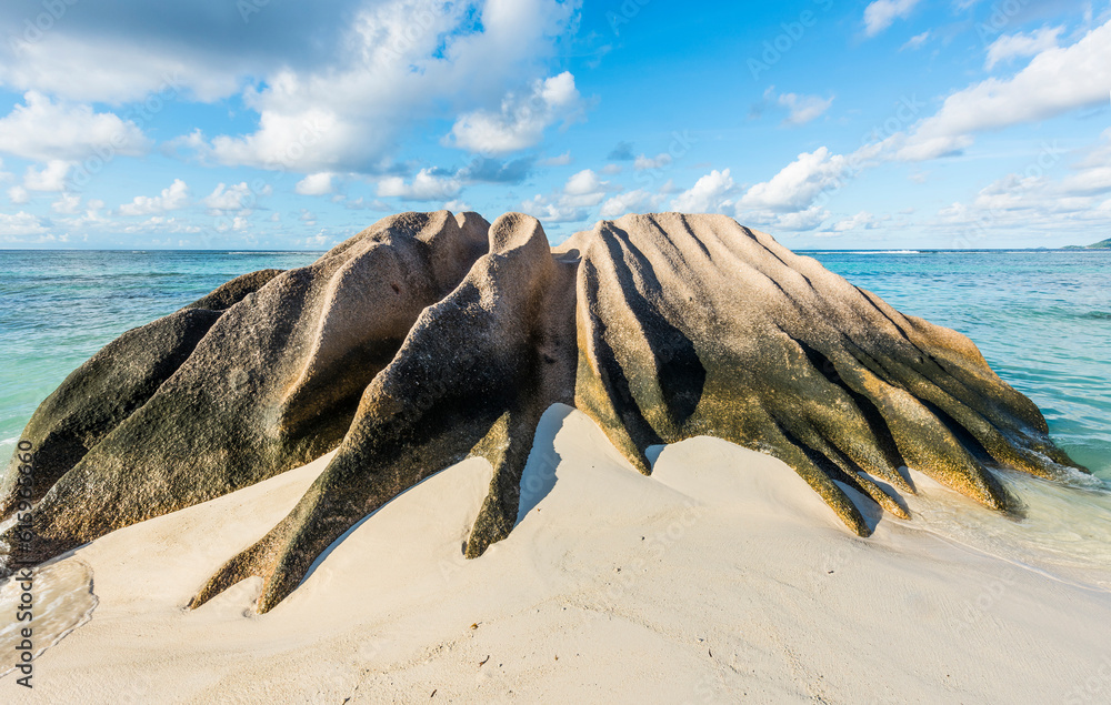 Beautifully shaped granite boulder in the sea shot in long exposure at Anse Source d'Argent beach, La Digue island, Seychelles Beautifully shaped granite boulder in the sea shot in long exposure at Anse Source d'Argent beach, La Digue island, Seychelles