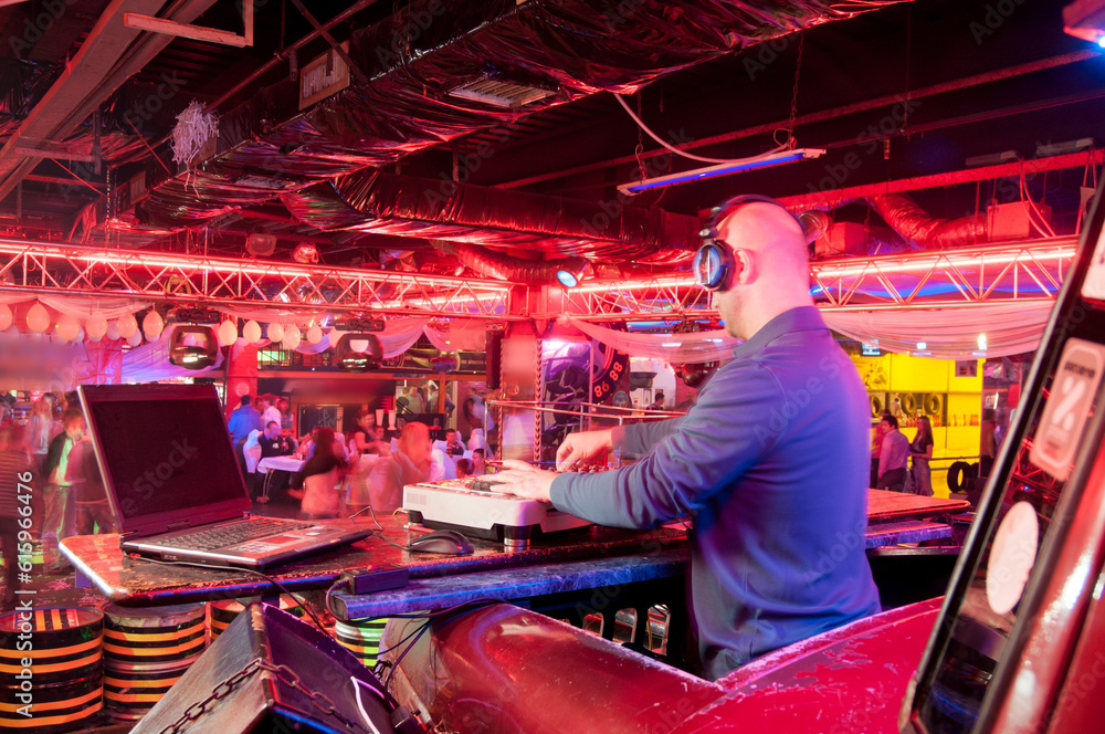 DJ behind the control panel vinyl records