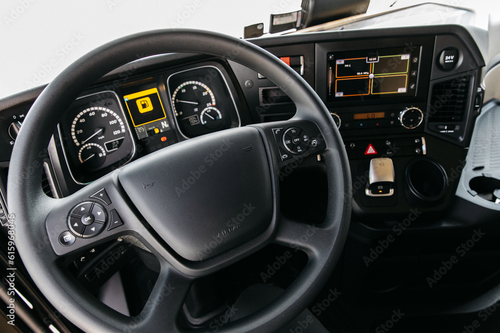 Semi Truck Interior View of Drivers Cockpit showing the controls and Navigation Equipment and Camera Screens