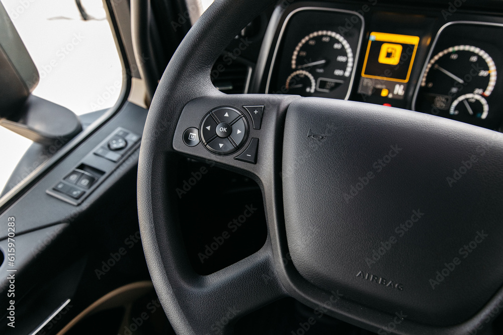 interior of a new diesel tractor truck. steering wheel, instrument panel, camera and navigation systems