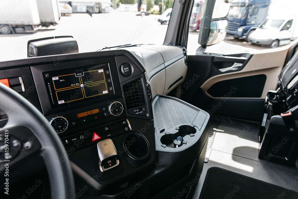 photo of the cab of a new modern tractor unit on a sunny day in the dealer's parking lot