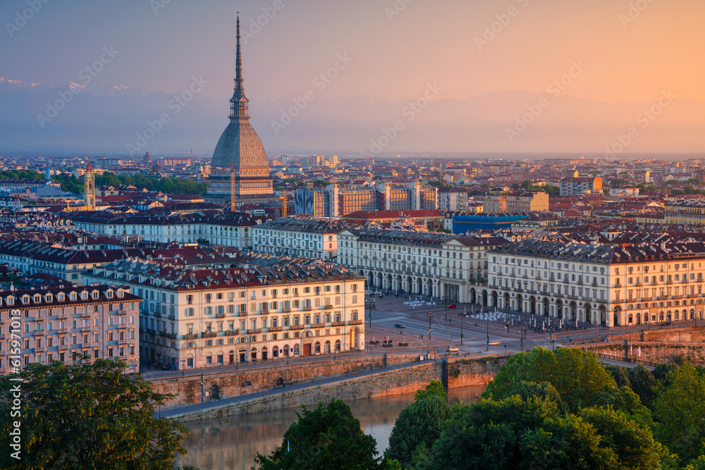 Aerial cityscape image of Turin, Italy during summer sunrise.
