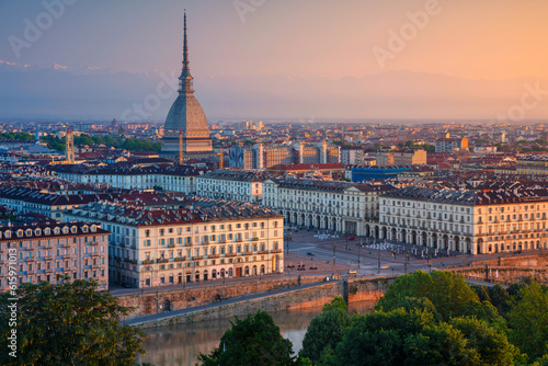 Aerial cityscape image of Turin, Italy during summer sunrise.